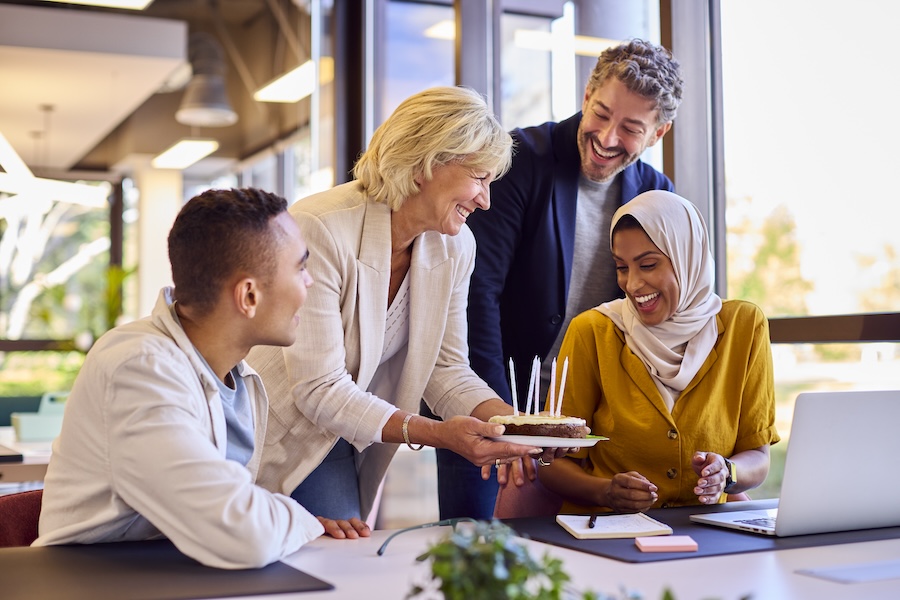 Staff Celebrating Birthday Of Female Colleague