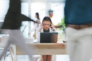 Headache, stress and employee on laptop in busy office with vertigo, mistake or disaster.