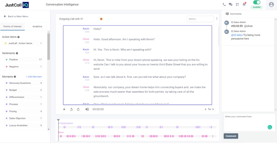 JustCall AI's conversation intelligence page showing a transcribed outbound call.