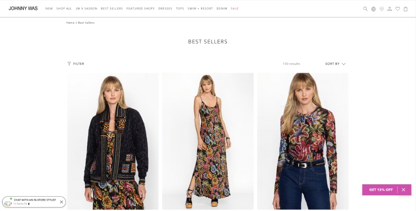 The Johnny Was homepage features three images of a model in a multicolored dress, jacket, and top on a clean white background.