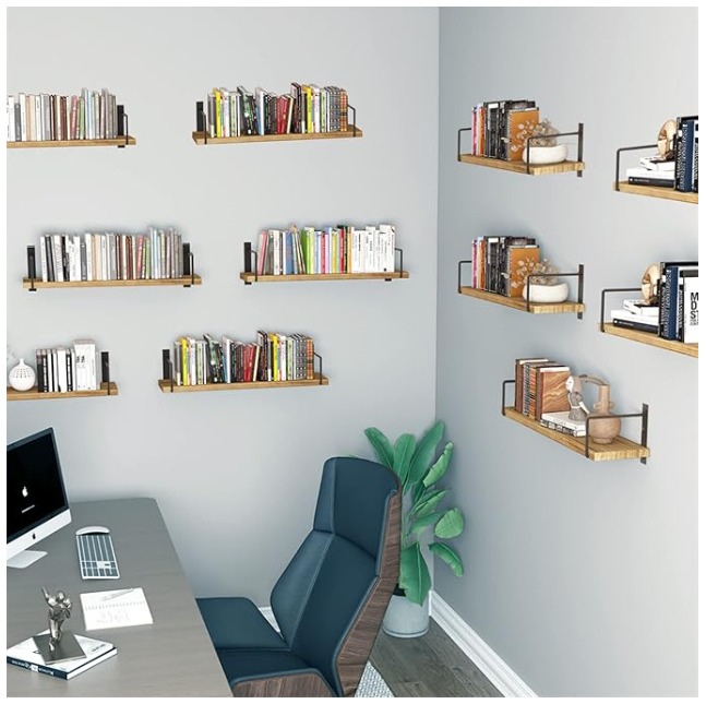 Floating shelves behind a home office desk on gray walls.