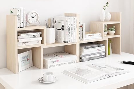 Wood shelving unit on top of a white desk.