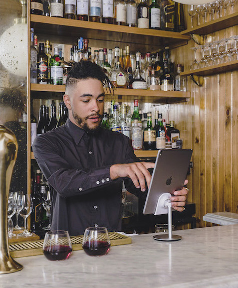 bartender taking orders on iPad