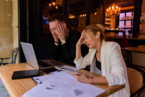 woman touching her head while thinking