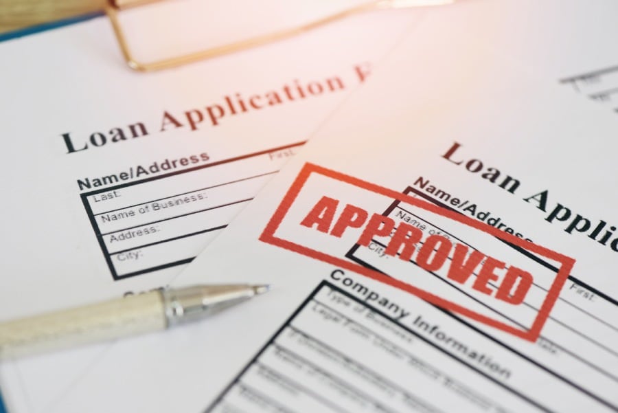 Loan application form with Rubber stamping that says Loan Approved.