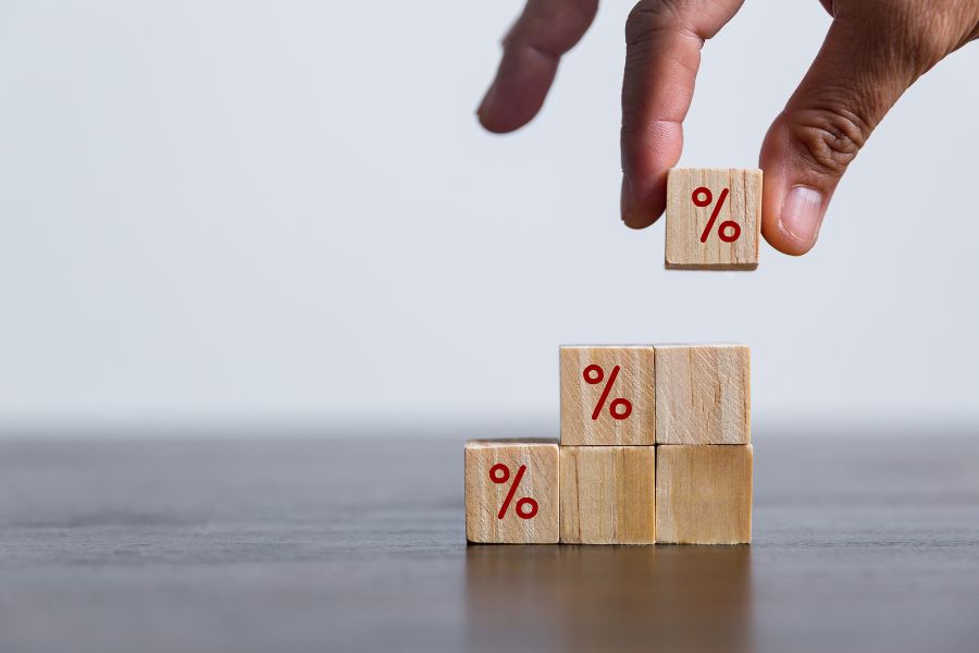 Closeup wood cubes with percentage symbol, Interest rate and dividend.