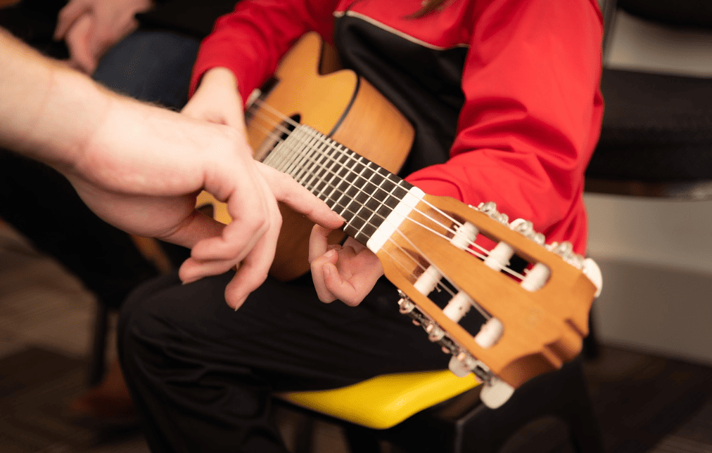 person holding a guitar