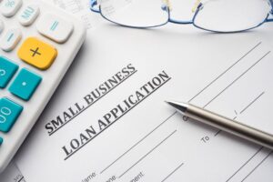 small business loan application on the desk.