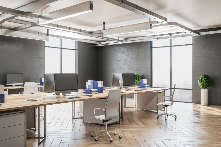 A contemporary private office with ergonomic chairs and large windows.