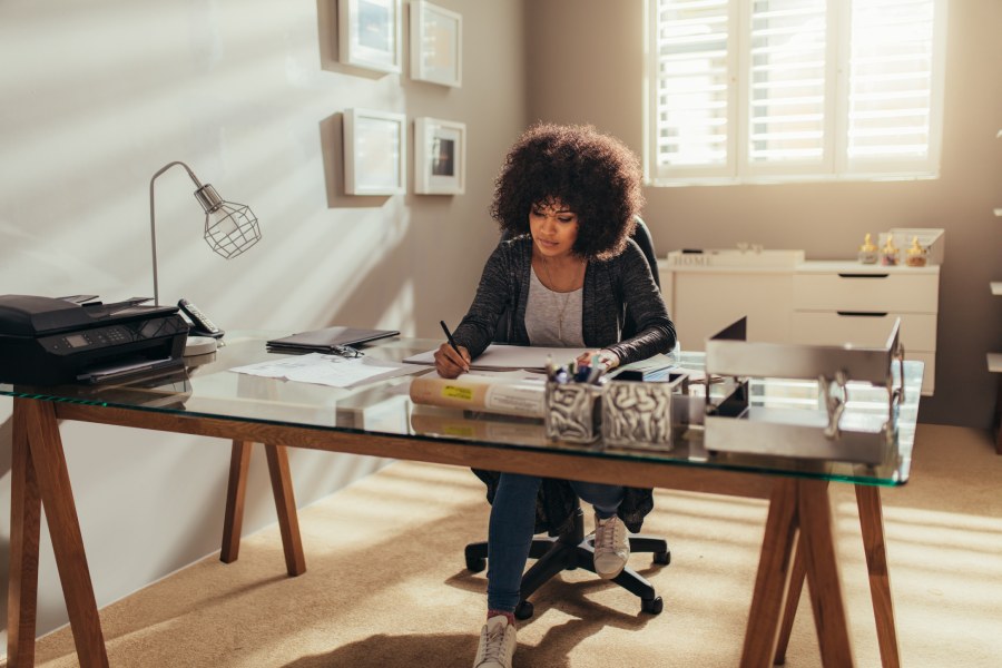 A woman working in modern home office.