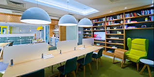 Regus coworking space with desks and seating in the Gatwick airport lounge.