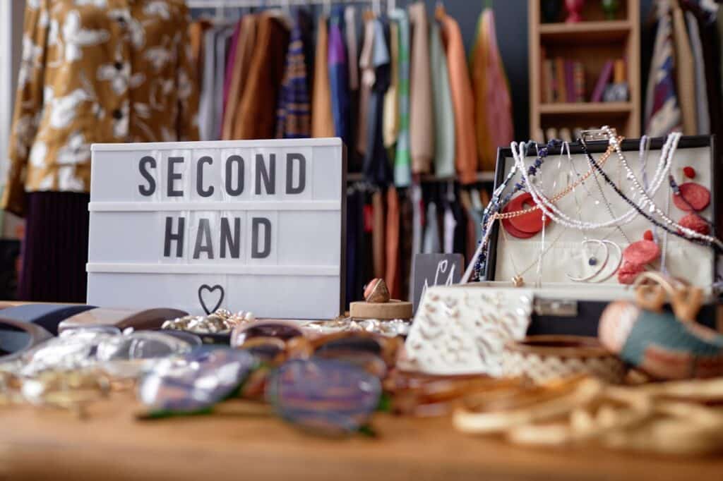 Section at a clothing store with "secondhand" signage