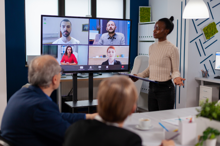 manager woman talking with remotely colleagues on