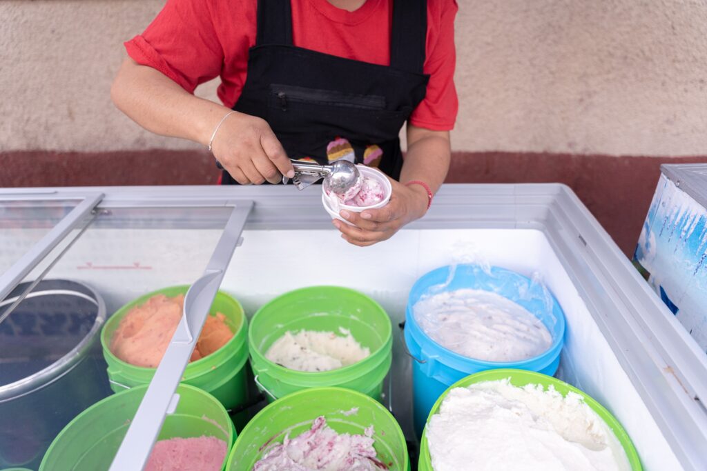 a woman serving ice cream