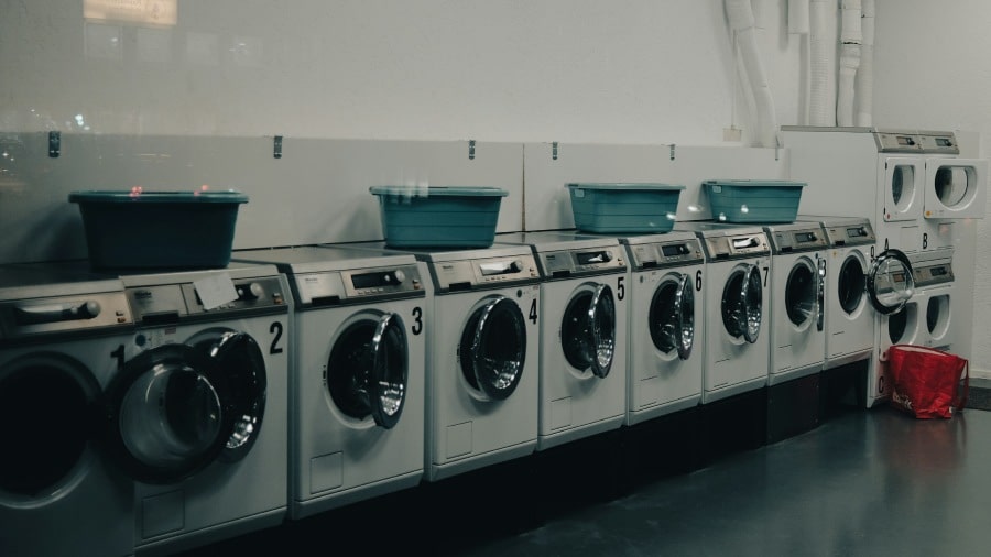 Row of washers and dryers.