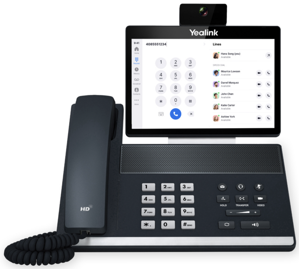 Yealink IP desk phone with video display and softkey controls.