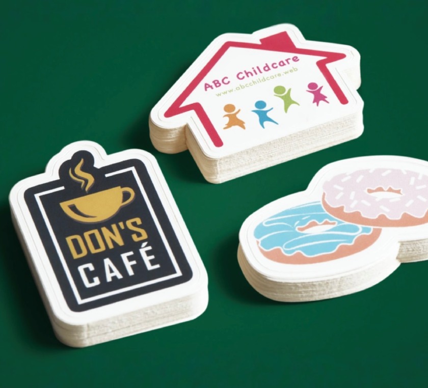 Sample die-cut stickers for various brands.