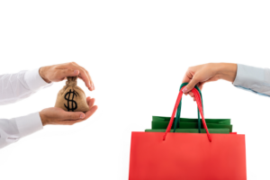 man holding money bag near woman with shopping bags