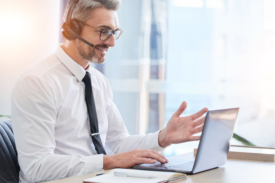 Video call center, laptop and businessman in virtual meeting, webinar and online sales negotiation