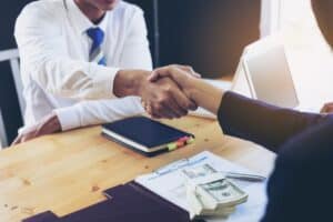 Business woman signing a loan for investment, negotiation.