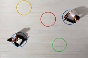 Business women in circles with laptops