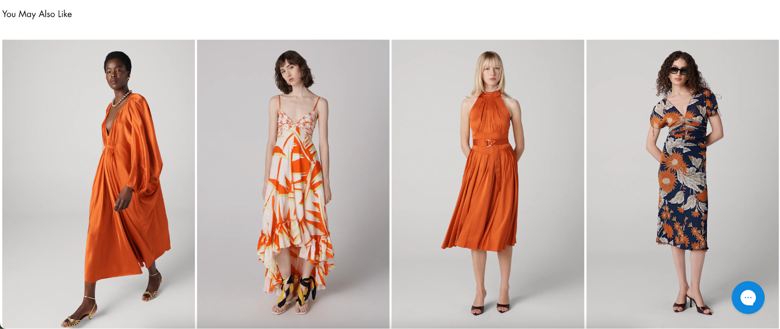 Related product suggestions for the Emersyn Dress shown in a row of four models. Dresses include orange and printed styles with varying silhouettes, such as a deep V-neck, halter neck, and ruched short-sleeve designs, all set against a light gray background.