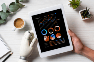 partial view of businessman with cyborg hand using digital tablet with infogrpahic on screen at