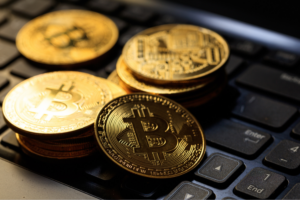 Bitcoins on a black laptop