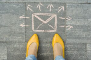 .Female feet with abstract envelope message letter.