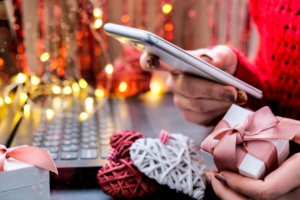 Mobile phone in hand. Mobile applications. Online promotions and discounts.