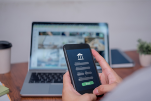 A person uses a smartphone application for a digital lending platform.