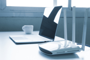 Laptop computer and router device on the table