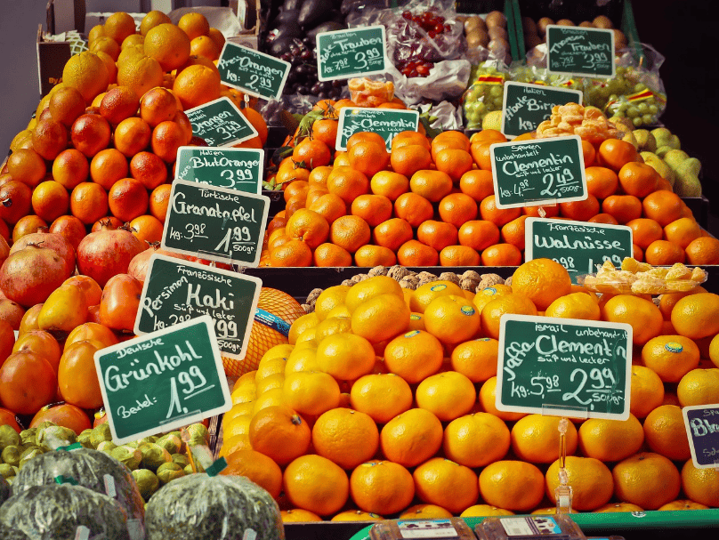 Carts of oranges with price tags