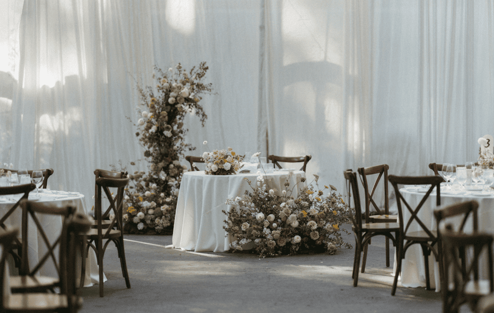 Floral workshop setup with arranged tables and flowers prepared for a hands-on experiential retail class.