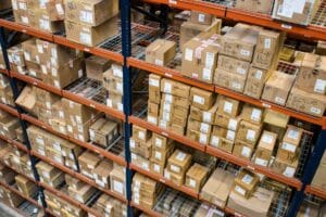 boxes on racks in a distribution warehouse.