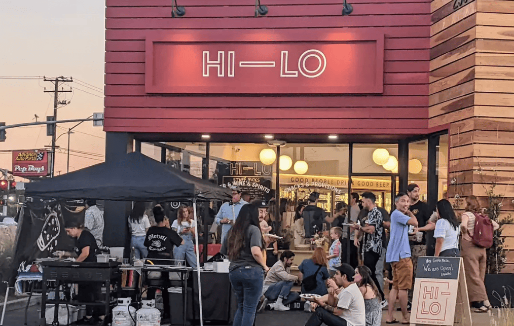Customers gathered outside Hi-Lo Liquor Market during a community-focused tasting event, illustrating experiential retail in action.