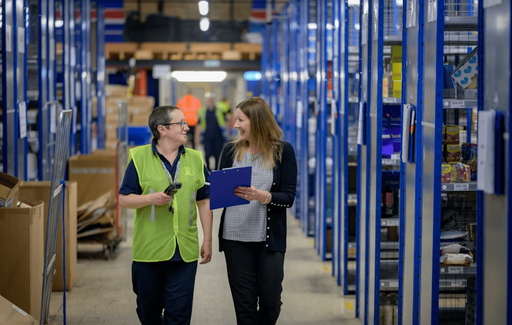 Staff walking through an inventory warehouse