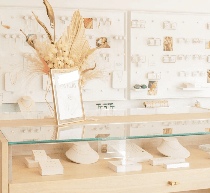 Jewelry boutique interior featuring curated product displays and decorative visual merchandising as part of an experiential retail store design.