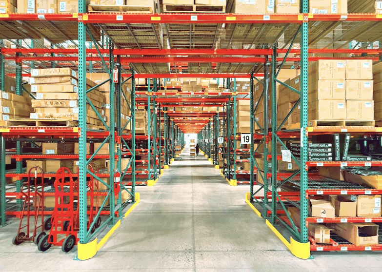 Organized warehouse shelving with boxed inventory, illustrating efficient storage and inventory management practices