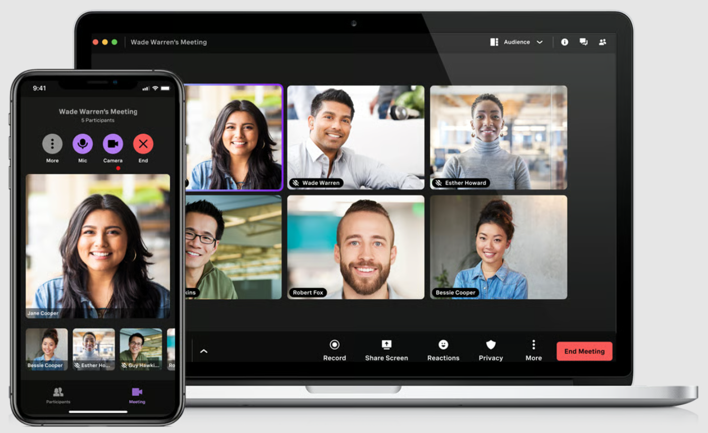 Laptop and mobile phone screen featuring a video conference from the Vonage Business app.